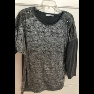 Willow & Jane grey sweater with decorative shoulder details.